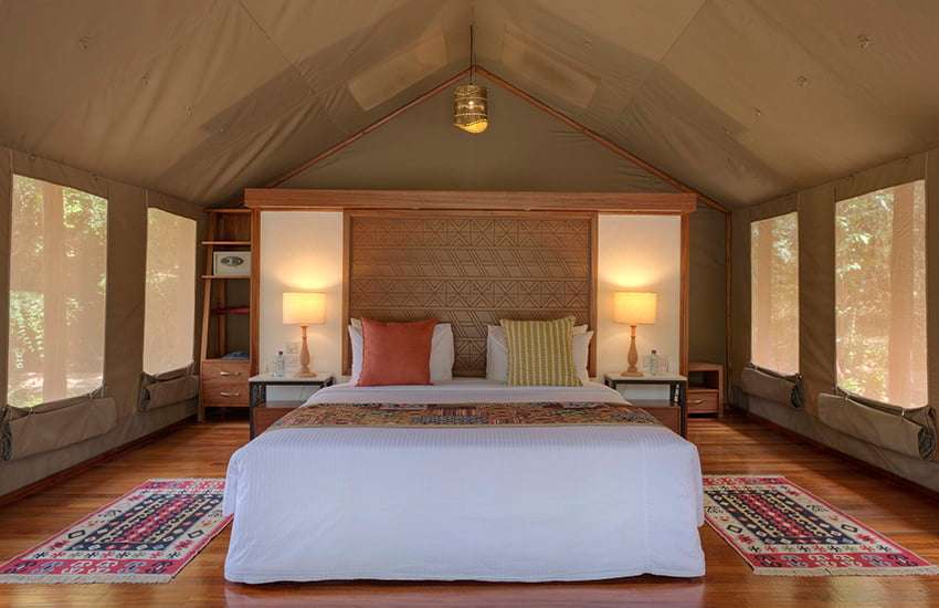 King-size bed inside the tented camp Sarova